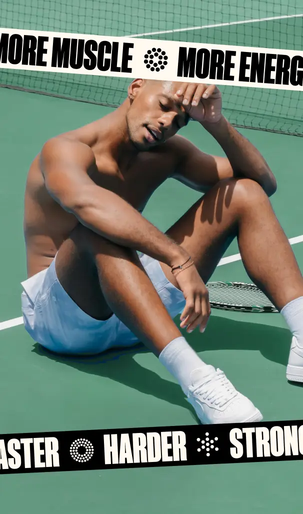 Lifestyle photo of a man sitting on a tennis court